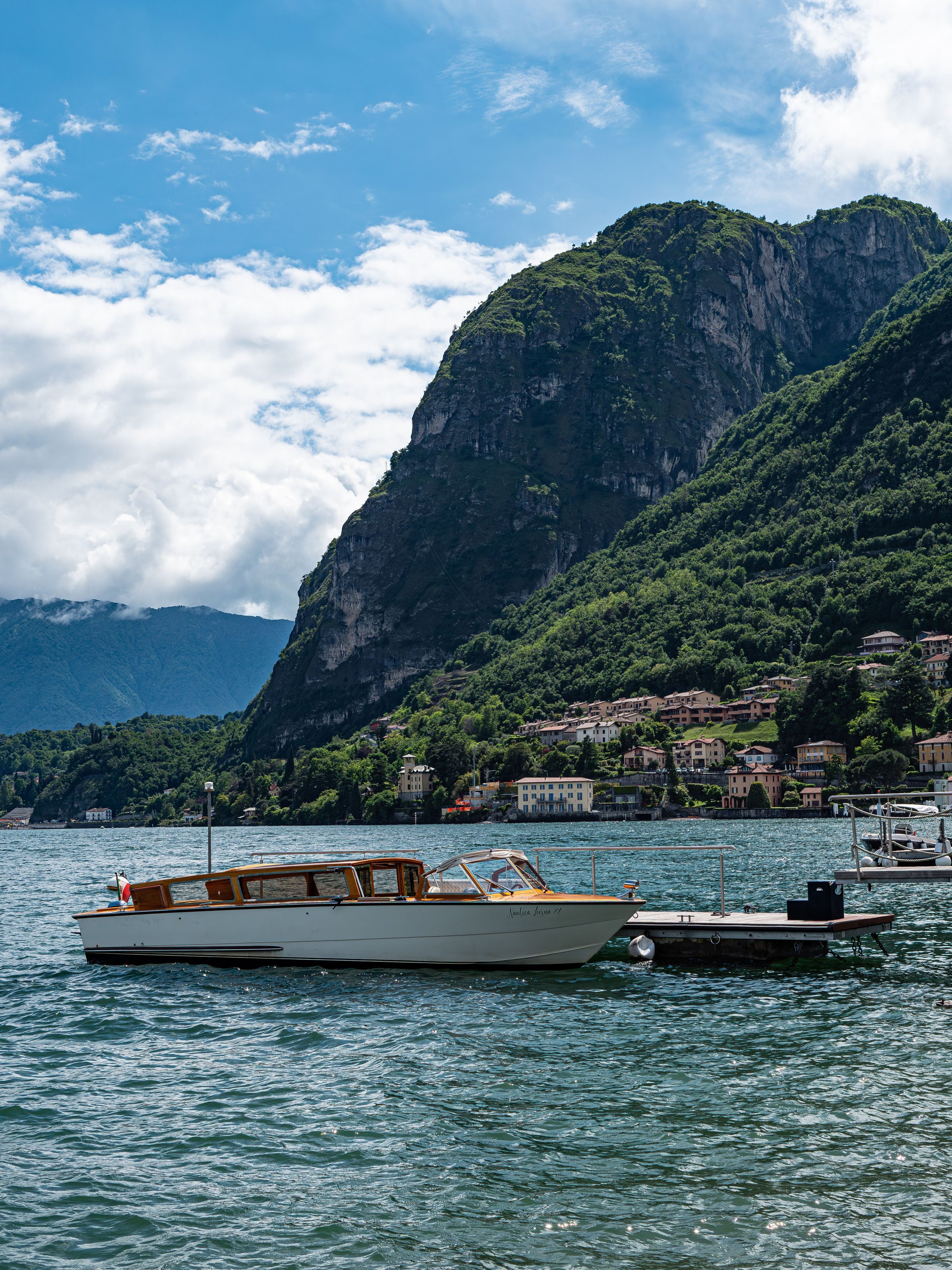 A motorboat crossing Lake Como near Menaggio.